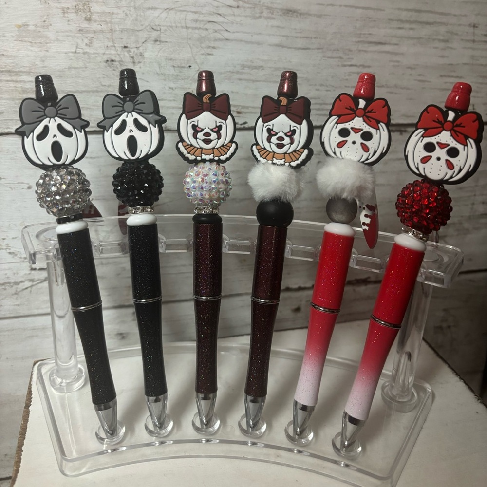 Halloween pens, keychains, and Stanley charms